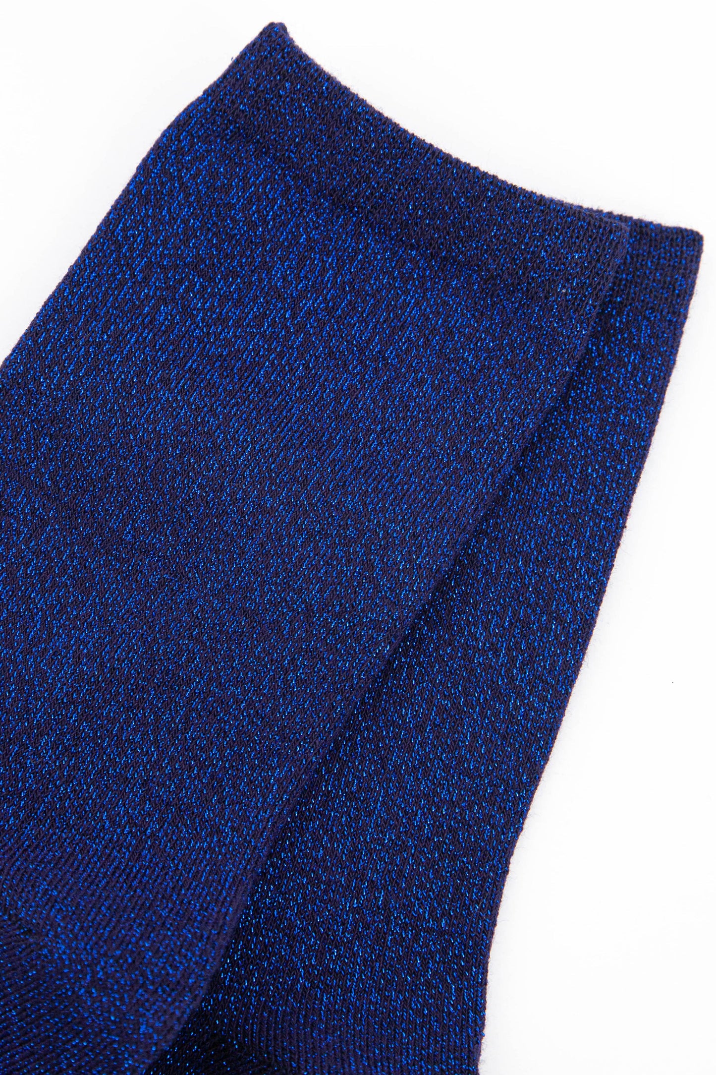 close up of the blue sparkly ankle socks showing the all over glitter effect of the material