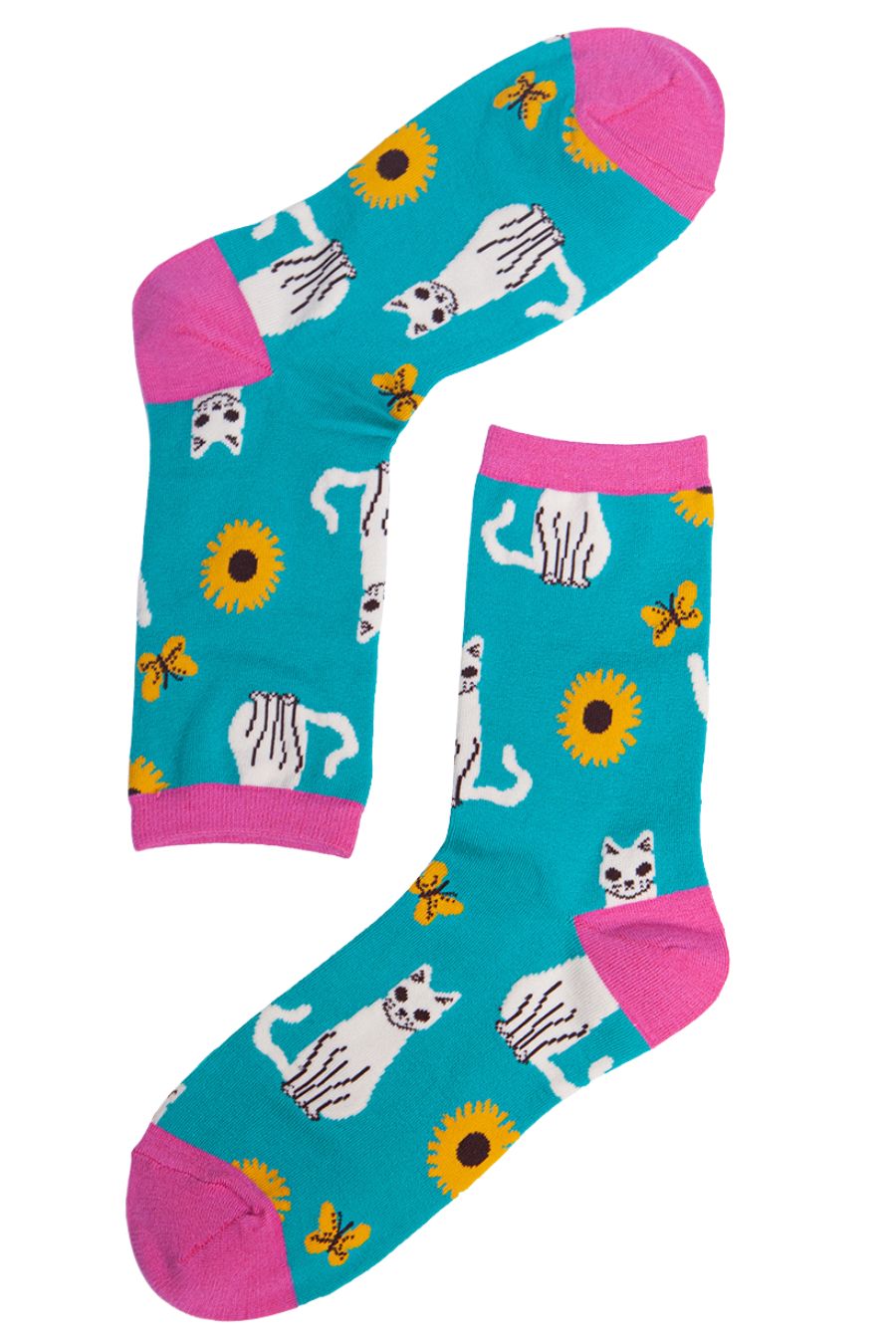 teal socks with white cats and yellow flowers
