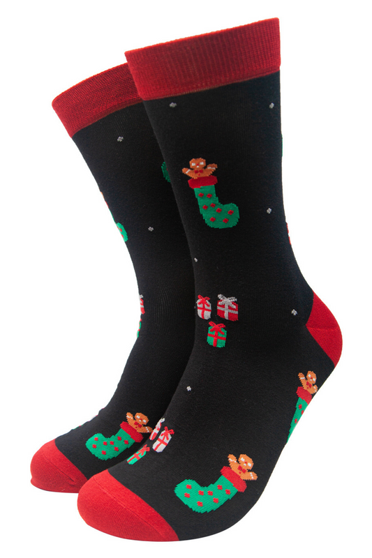 black dres socks with red toe, heel, trim featuring xmas stockings and gifts