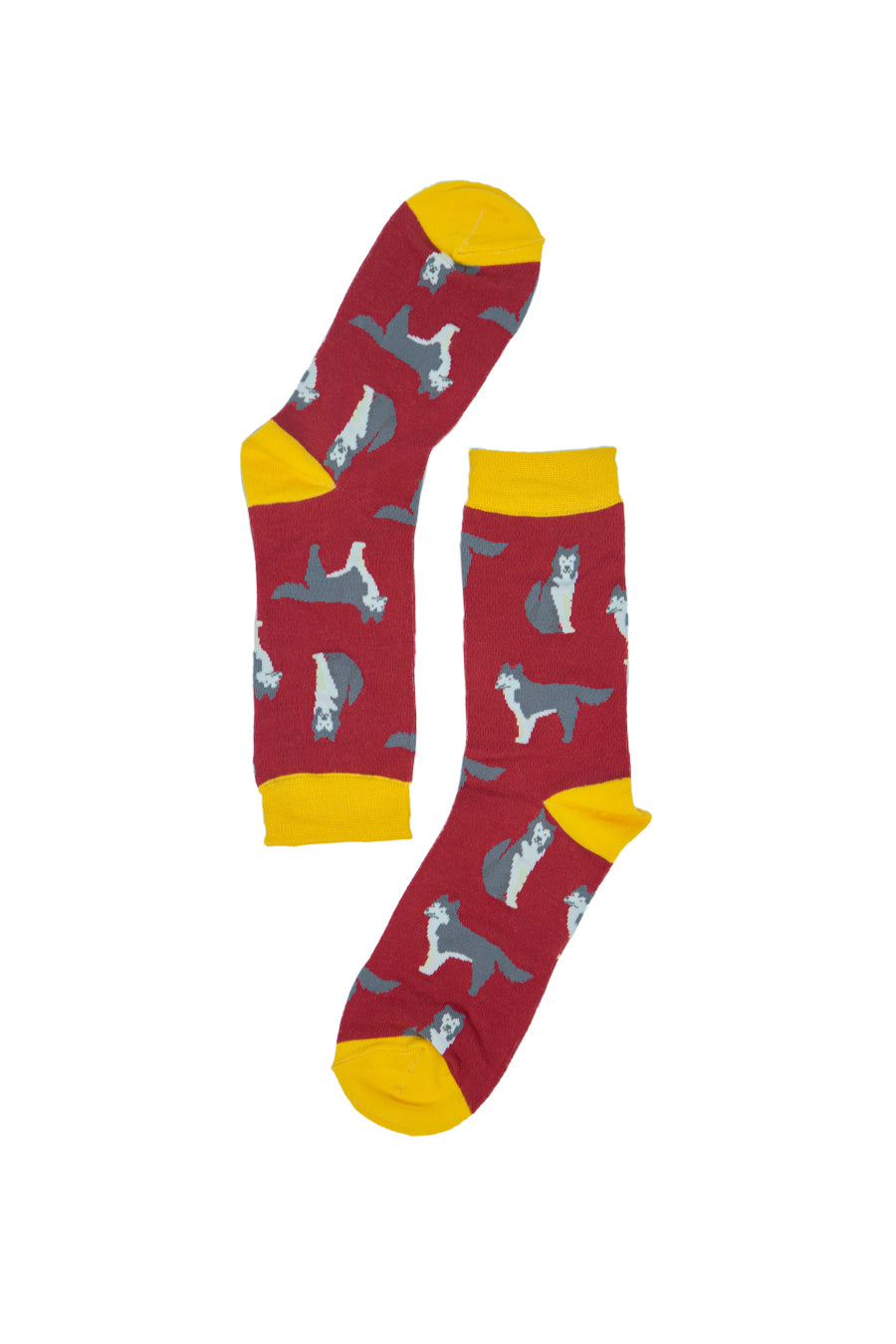 red and yellow bamboo socks with an all over pattern of husky dogs