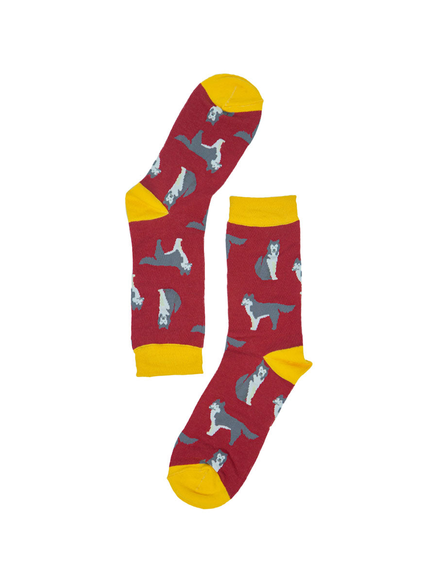red and yellow bamboo socks with an all over pattern of husky dogs