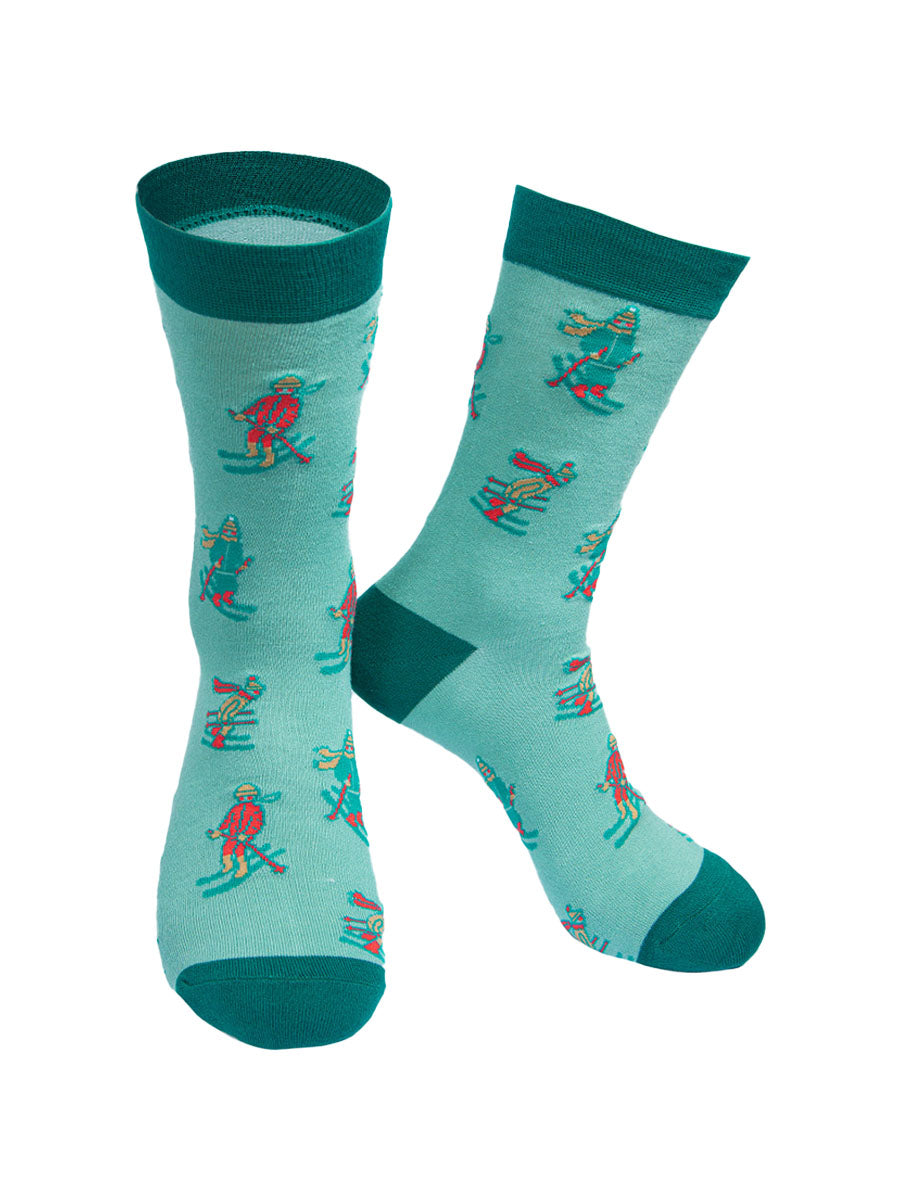 green socks with a pattern of red and green skiers all over