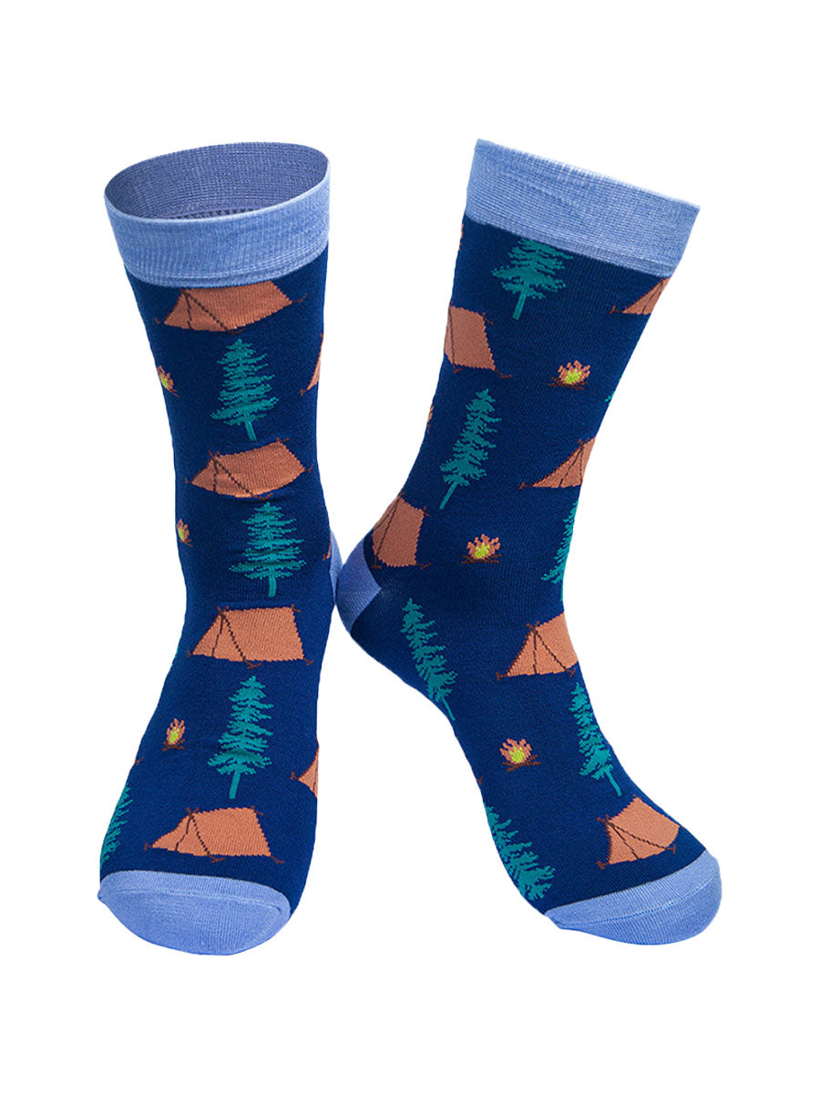 blue bamboo socks with a pattern of tents, campfires and tress all over 