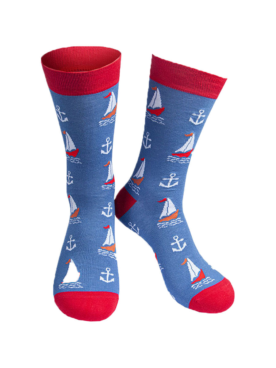 Mens blue bamboo socks with red toes and cuffs. Featuring sailing boat and anchors