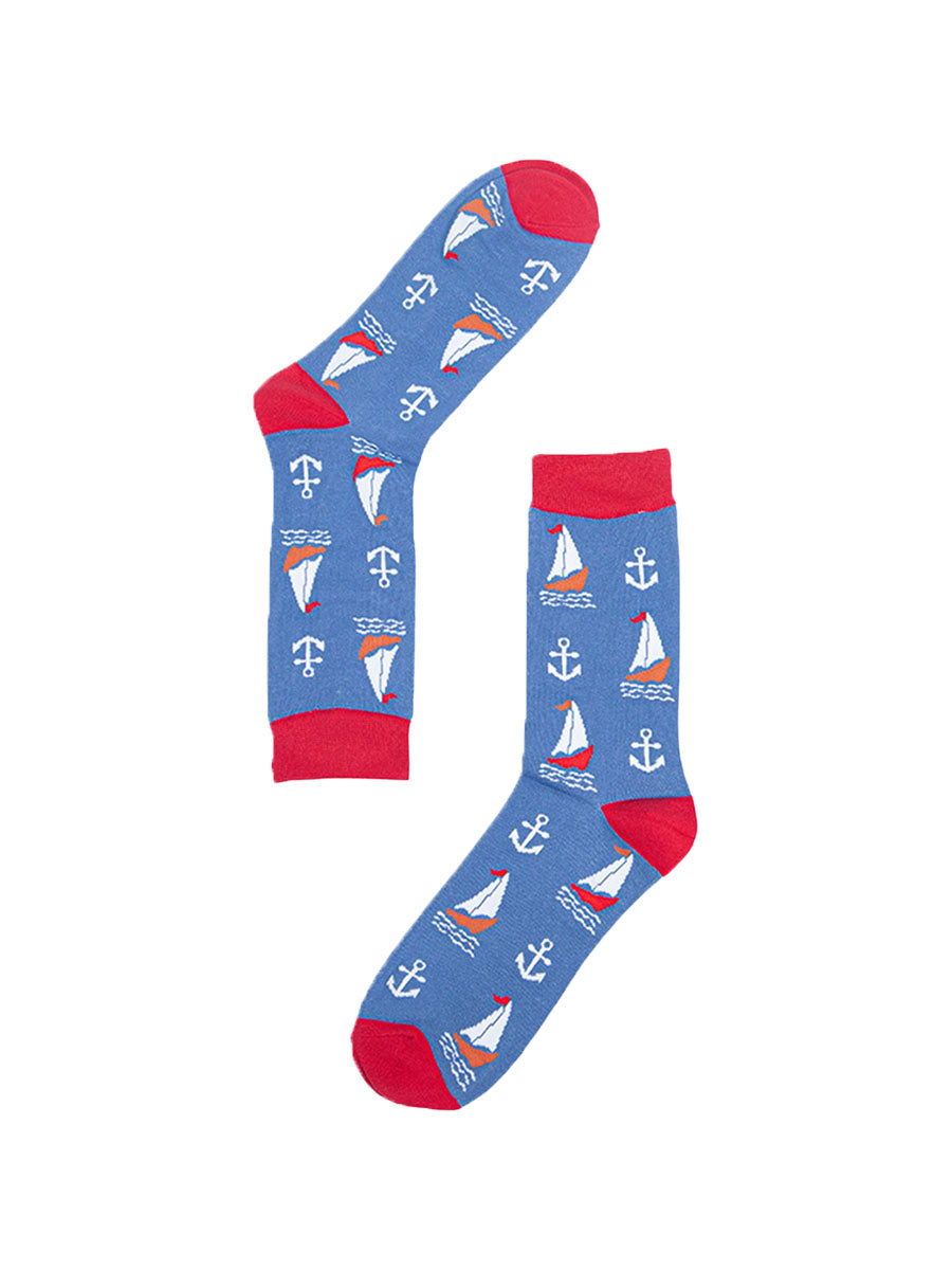Mens blue and red bamboo socks lying flat. They are patterned with sail boats and anchors.