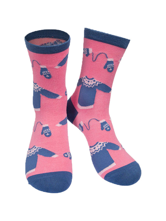 pink and blue bamboo socks with a pattern of xmas jumpers and winter gloves