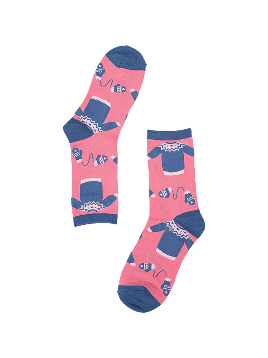 pink and blue ankle socks with Christmas sweaters and winter gloves on them