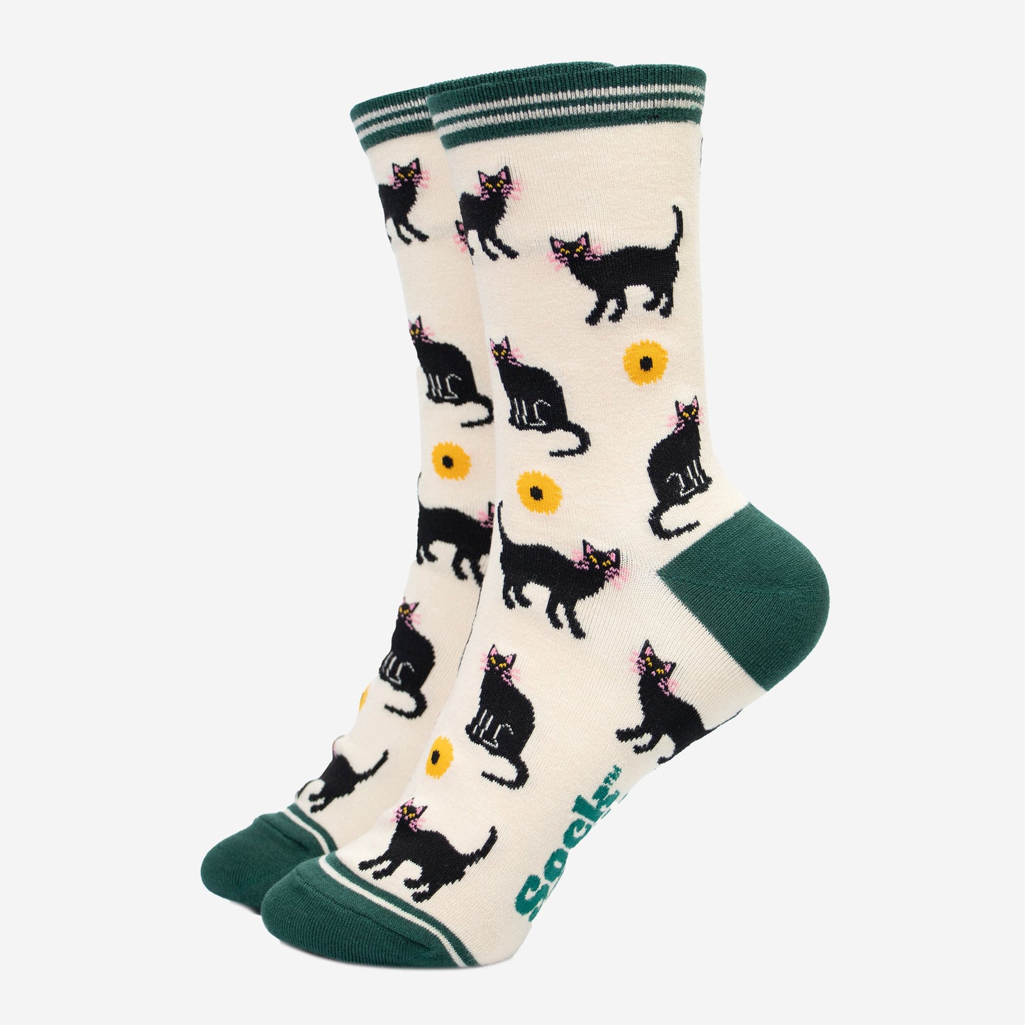 cream socks with green toe, heel and striped cuff. there is a pattern of black cats and yellow sunflowers all over the socks