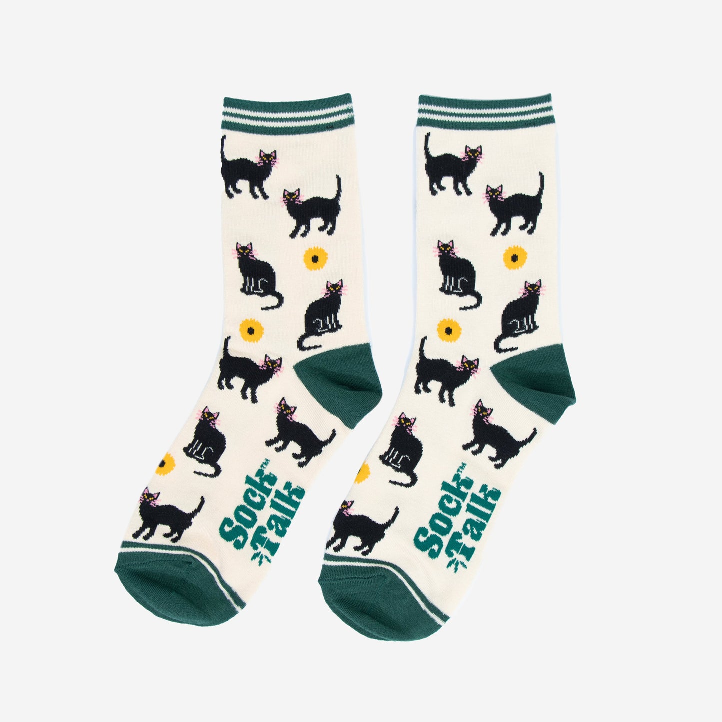 showing the black cat socks laying flat, the pattern of cats and sunflowers is all over the socks, the cream background is contrasted by green heel, toe and stiped cuffs