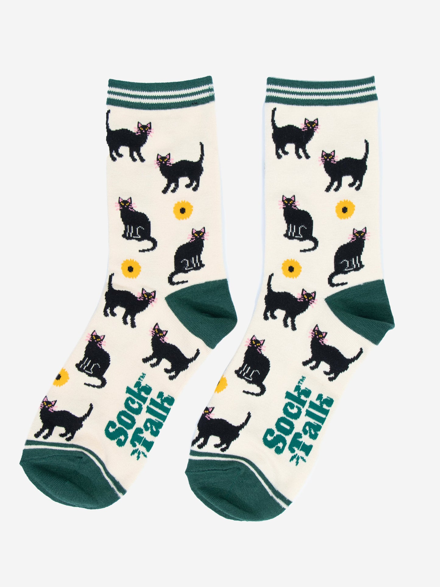 showing the black cat socks laying flat, the pattern of cats and sunflowers is all over the socks, the cream background is contrasted by green heel, toe and stiped cuffs