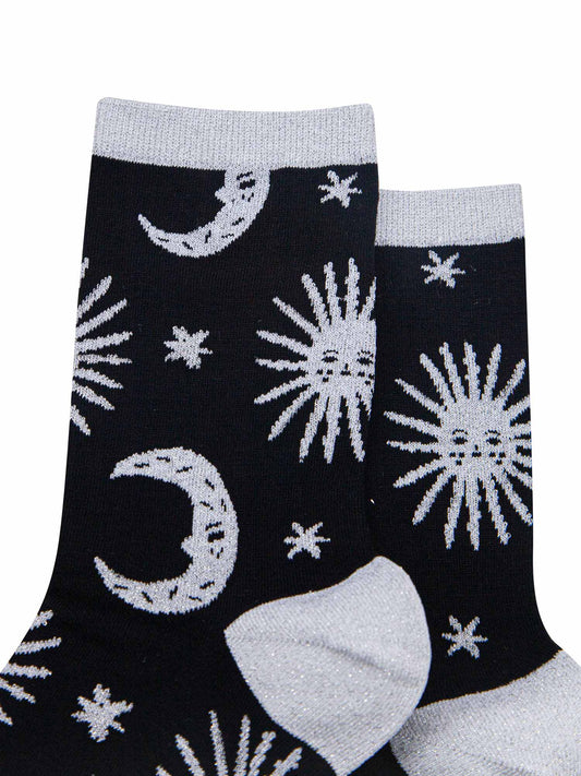 close up, showing the silver glitter heel, toe, cuff and sparkles on the celestial patterns