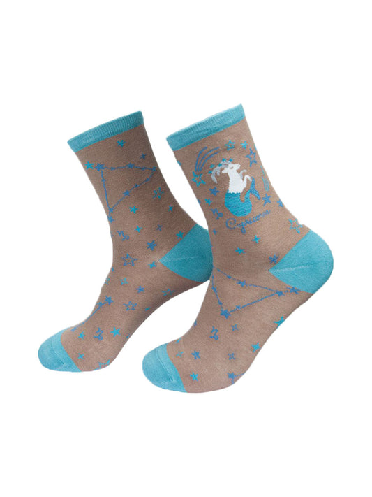 grey, blue ankle socks with the zodiac sign and celestial constellaion of capricorn