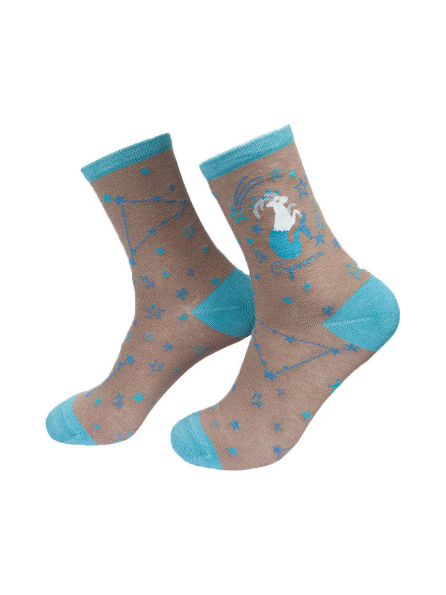 grey, blue ankle socks with the zodiac sign and celestial constellaion of capricorn