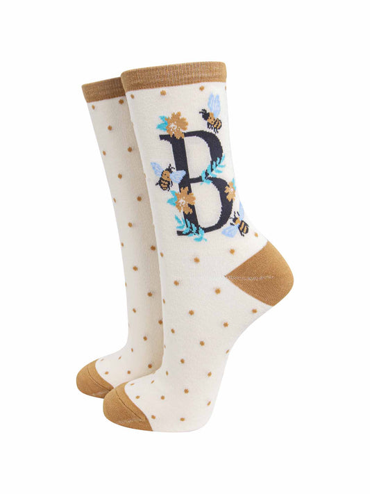 cream and gold ankle socks with a letter B and bumblebees