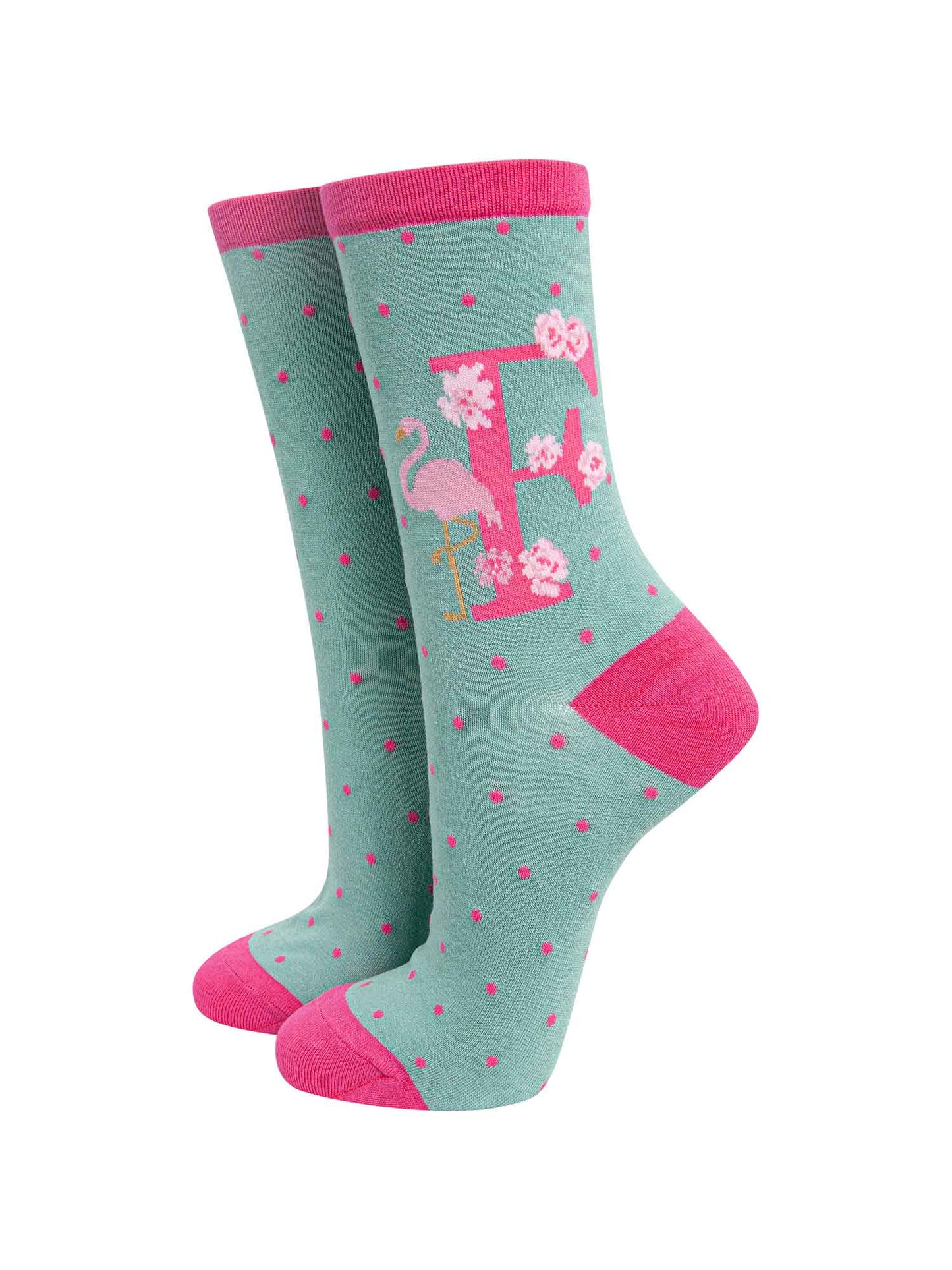 green, pink bamboo socks with the letter F and a flamingo
