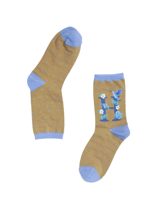 mustard yellow, blue bamboo socks with the initial H