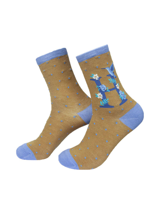 mustard yellow, blue ankle socks with a letter H and a hummingbird