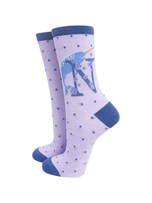 lilac, blue ankle socks with a letter N and a narwhal