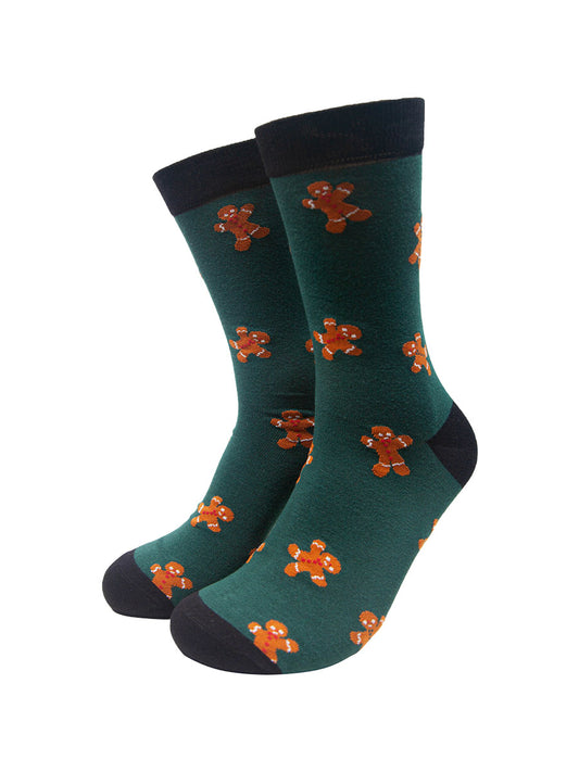 green dress socks with a pattern of gingerbread men all over them