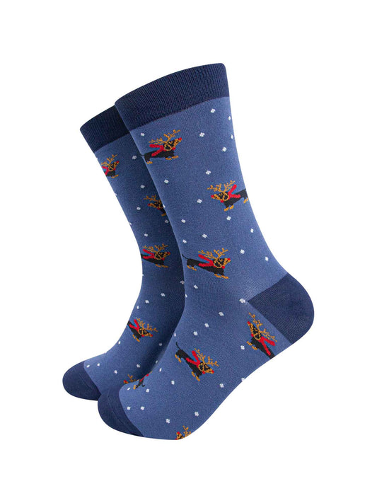 blue dress socks with a pattern of sausage dogs wearing reindeer antlers