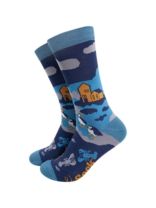 blue bamboo socks designed to look like a coastal scene with puffins, lobsters and a shoreline