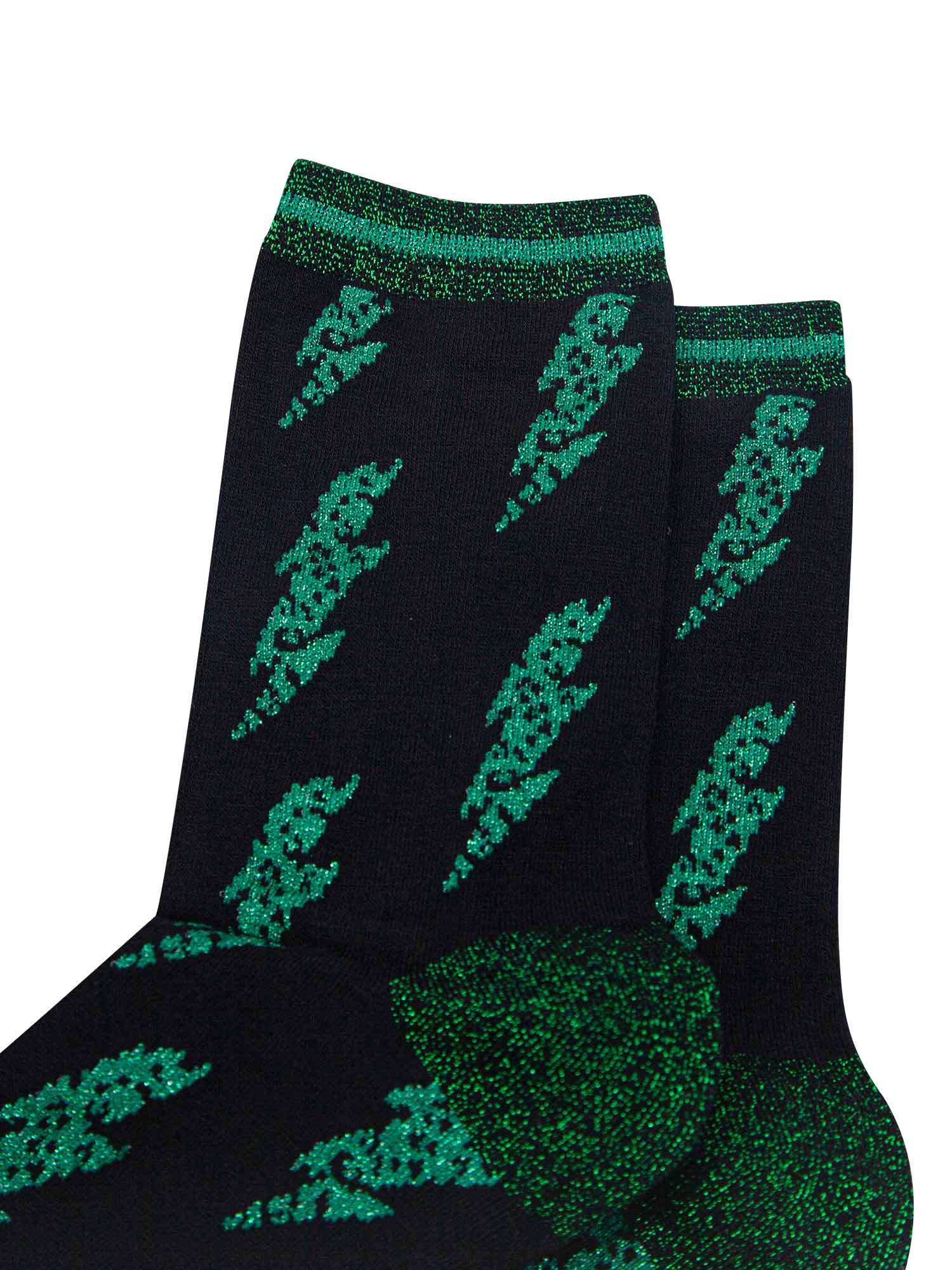 close up of green lightning bolts and glitter trim