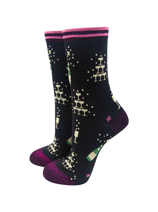 black bamboo socks with gold glitter champagne glasses and bottles, the socks have a pink glitter heel, toe and cuff