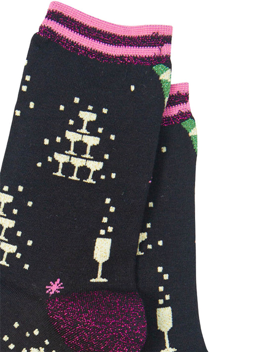 close up of the champagne celebration glitter pattern on the black bamboo socks