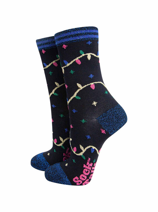 black bamboo socks with blue glitter heel, toe and trim with a multicoloured xmas lights patterns