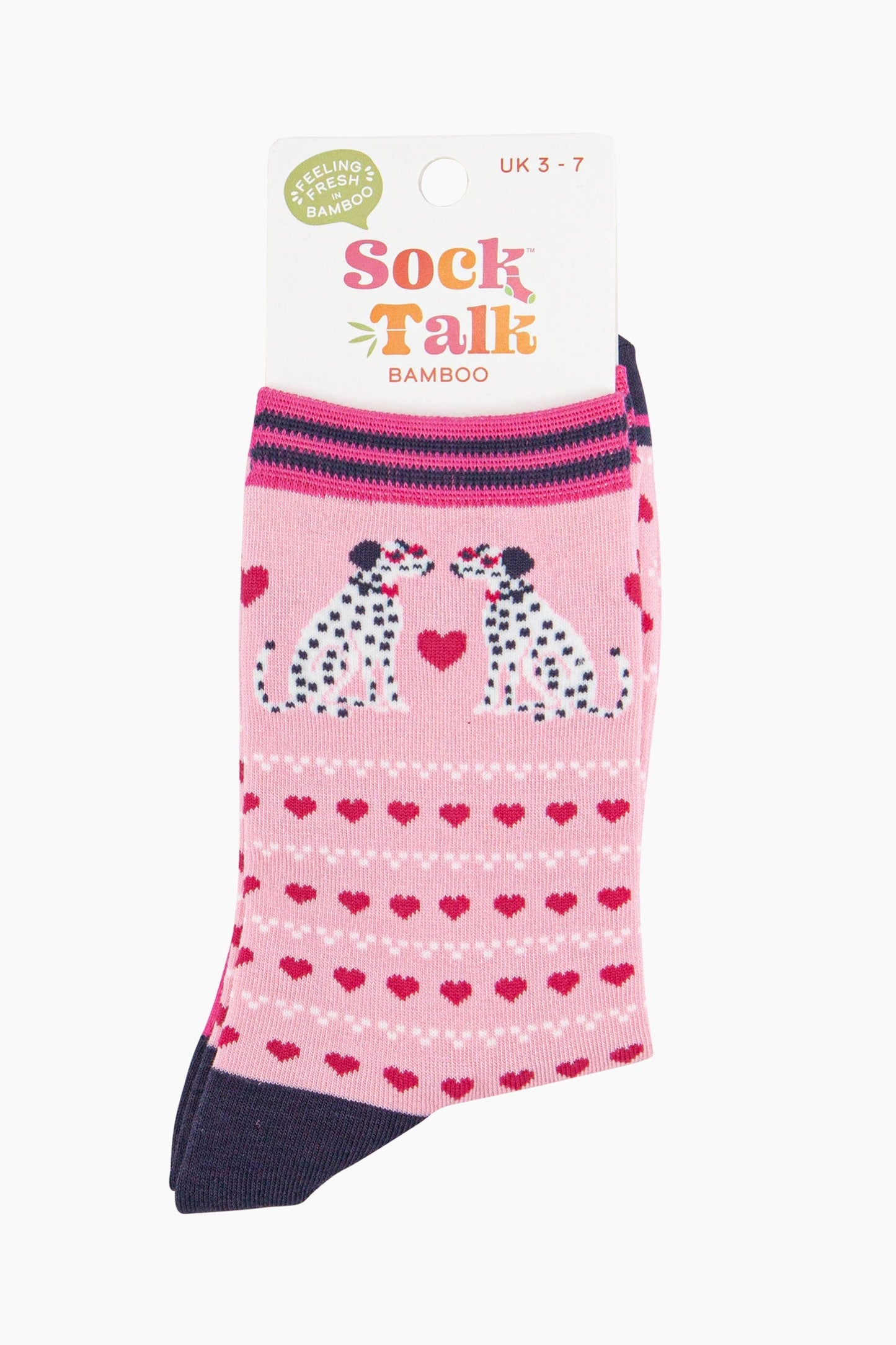 light pink dalmatian dog and pink love heart ankle socks in their sock talk packaging, the socks are a uk size 3-7.