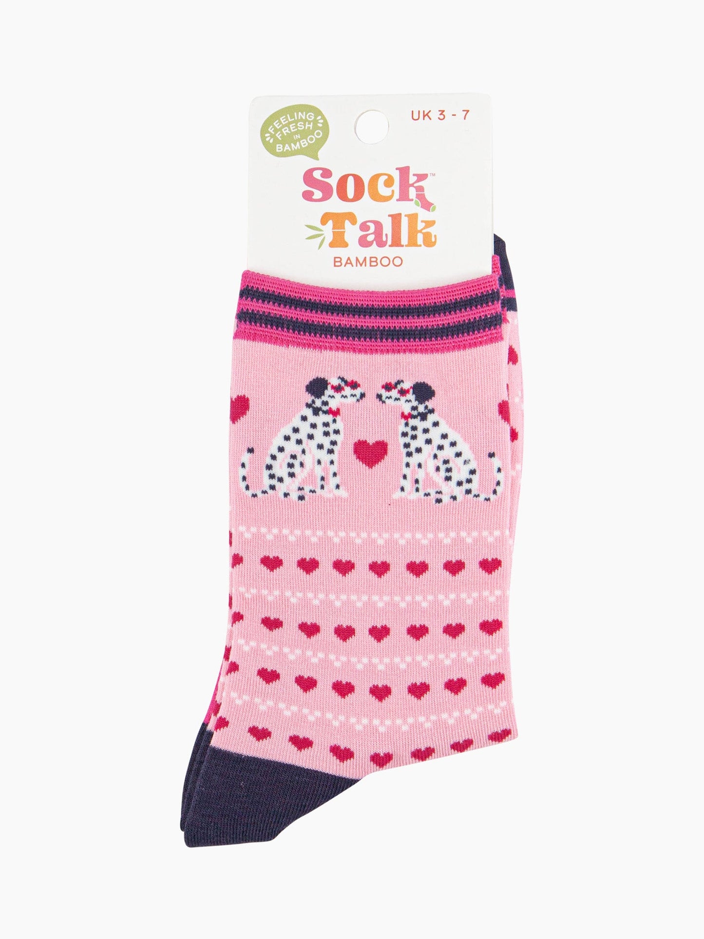 light pink dalmatian dog and pink love heart ankle socks in their sock talk packaging, the socks are a uk size 3-7.