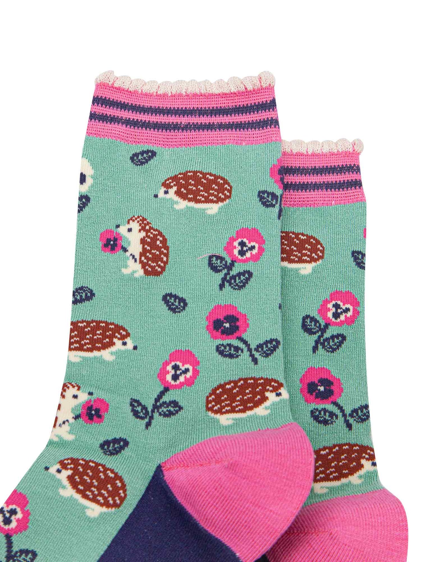 close up of the pattern. the hedgehogs are brown and beige, some are sitting holding pink pansy flowers, others are walking among the flowers. 

