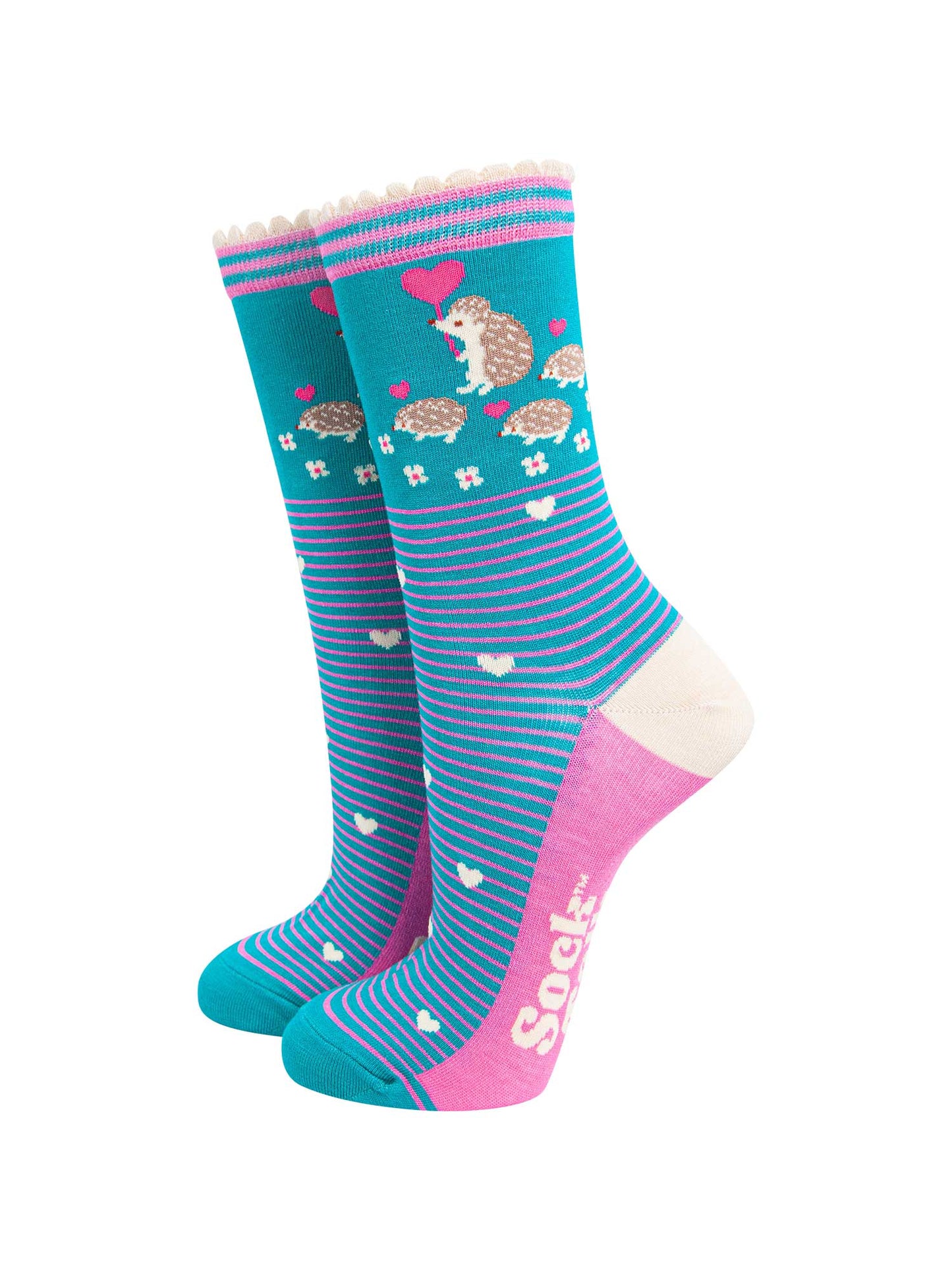 teal bamboo socks with pink horizontal pinstripes. on the ankle of the socks there is an adult hedgehog with three baby hedgehogs each carrying pink love heart shaped balloons.