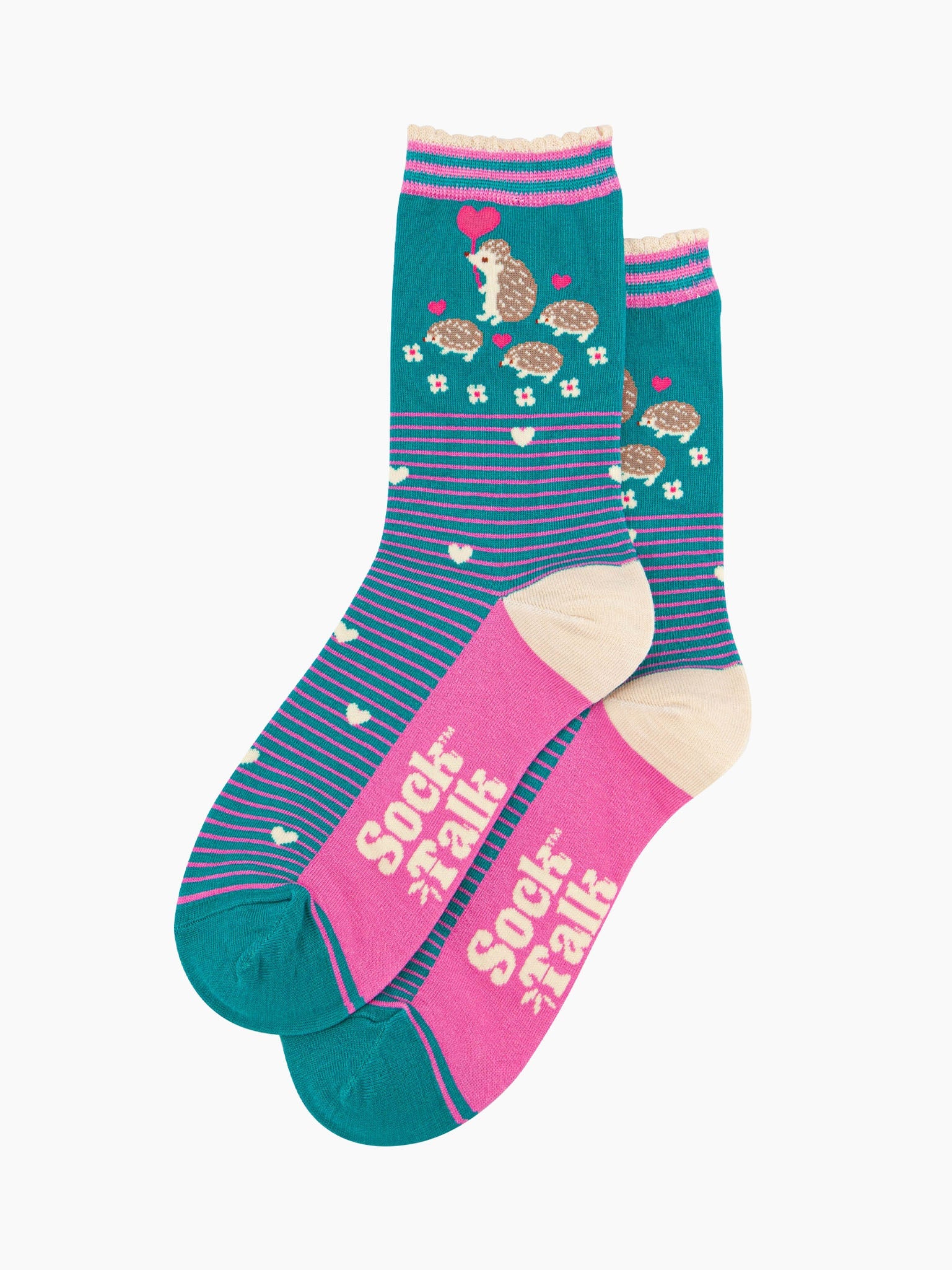 the pair of teal hedgehog socks laying flat one overlapping the other. showing clearly the teal background of the socks which is contrasted by pink pinstripes. on the ankle of the socks there is a woodland scene with a family of hedgehogs.  the sock talk logo is visible on the base of the sole. 
