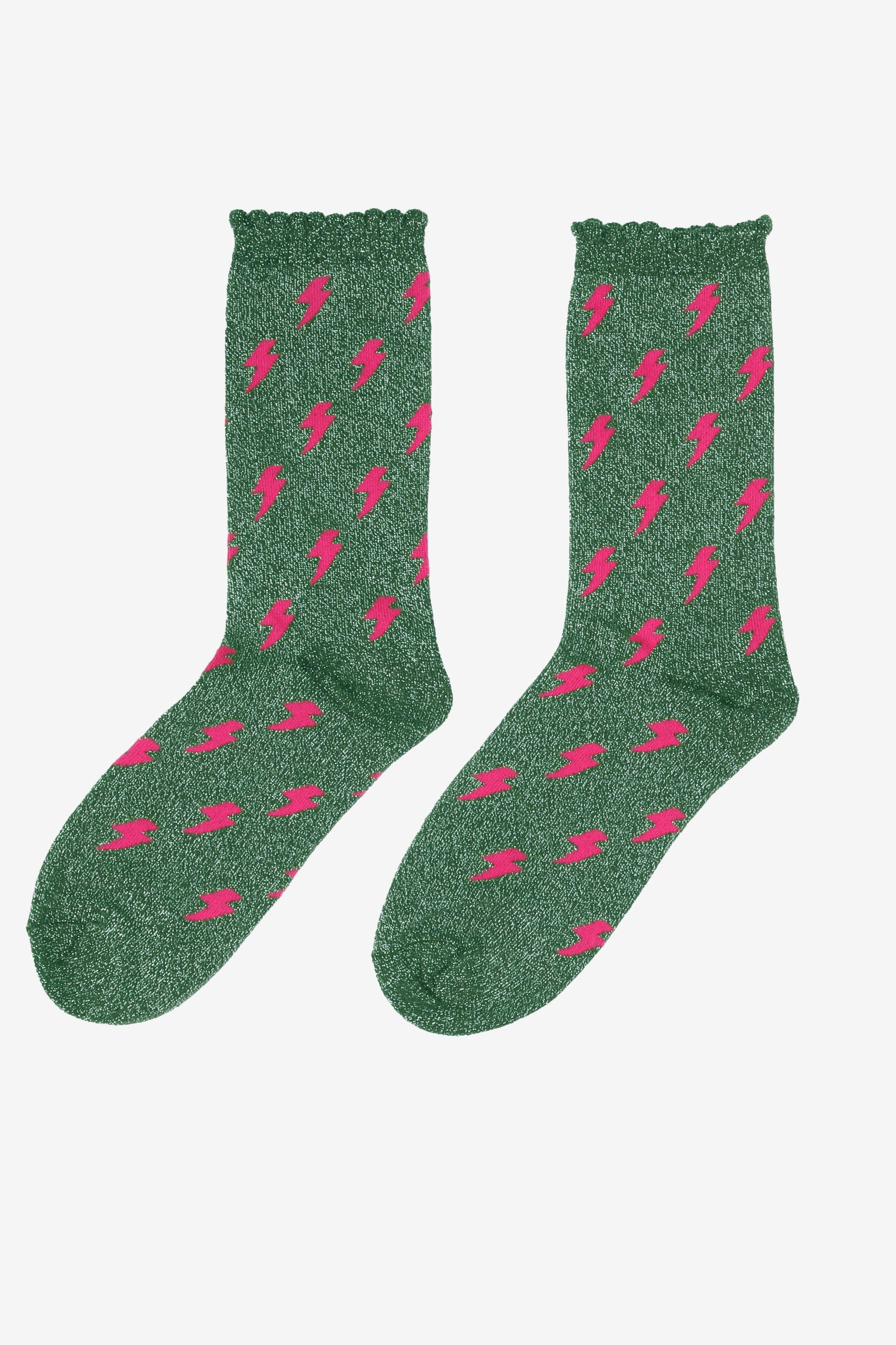 green cotton ankle socks with an all over pink lightning bolt print pattern and silver glitter shimmer, the socks have scalloped cuffs