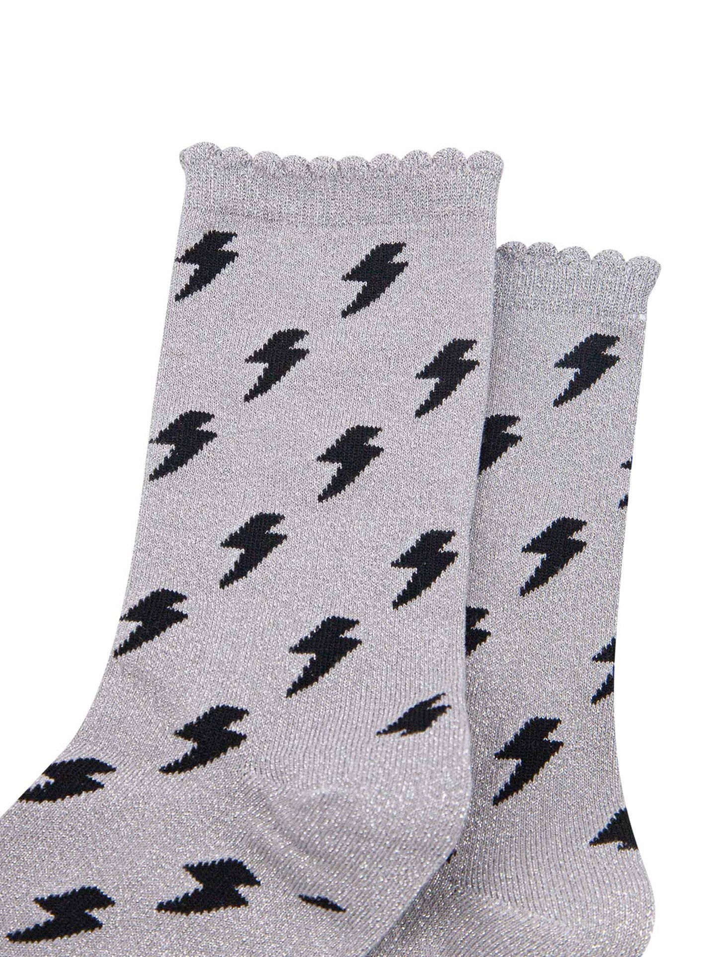 light grey cotton ankle socks with an all over black lightning bolt print pattern and silver glitter shimmer, the socks have scalloped cuffs