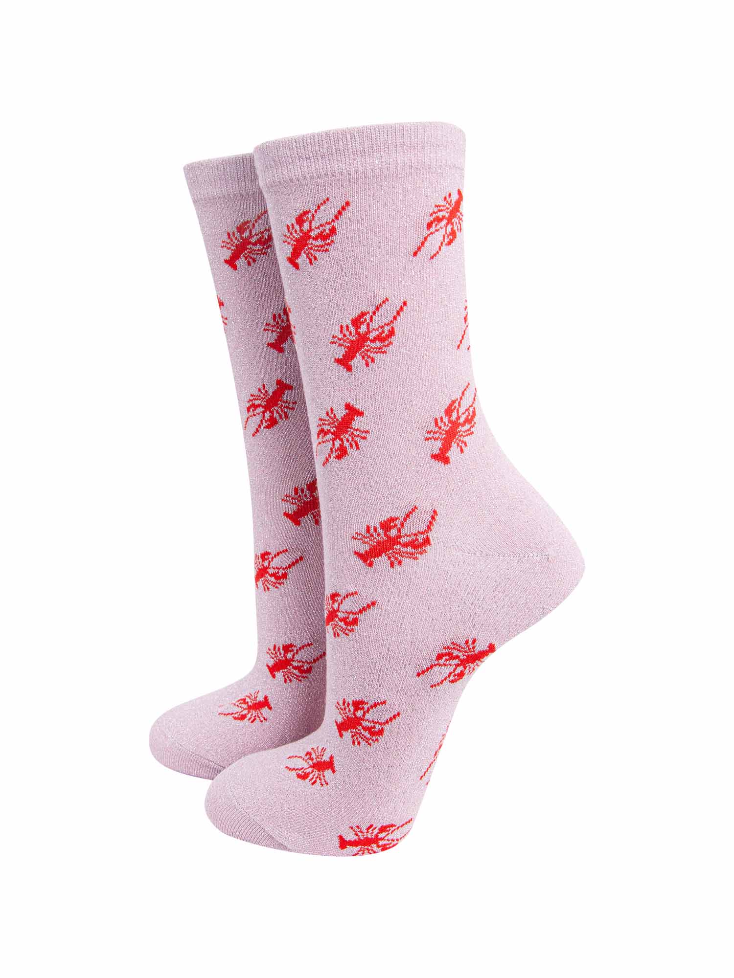 pink cotton socks with an all over red lobster print pattern and silver glitter shimmer, the socks have a scalloped cuff edge