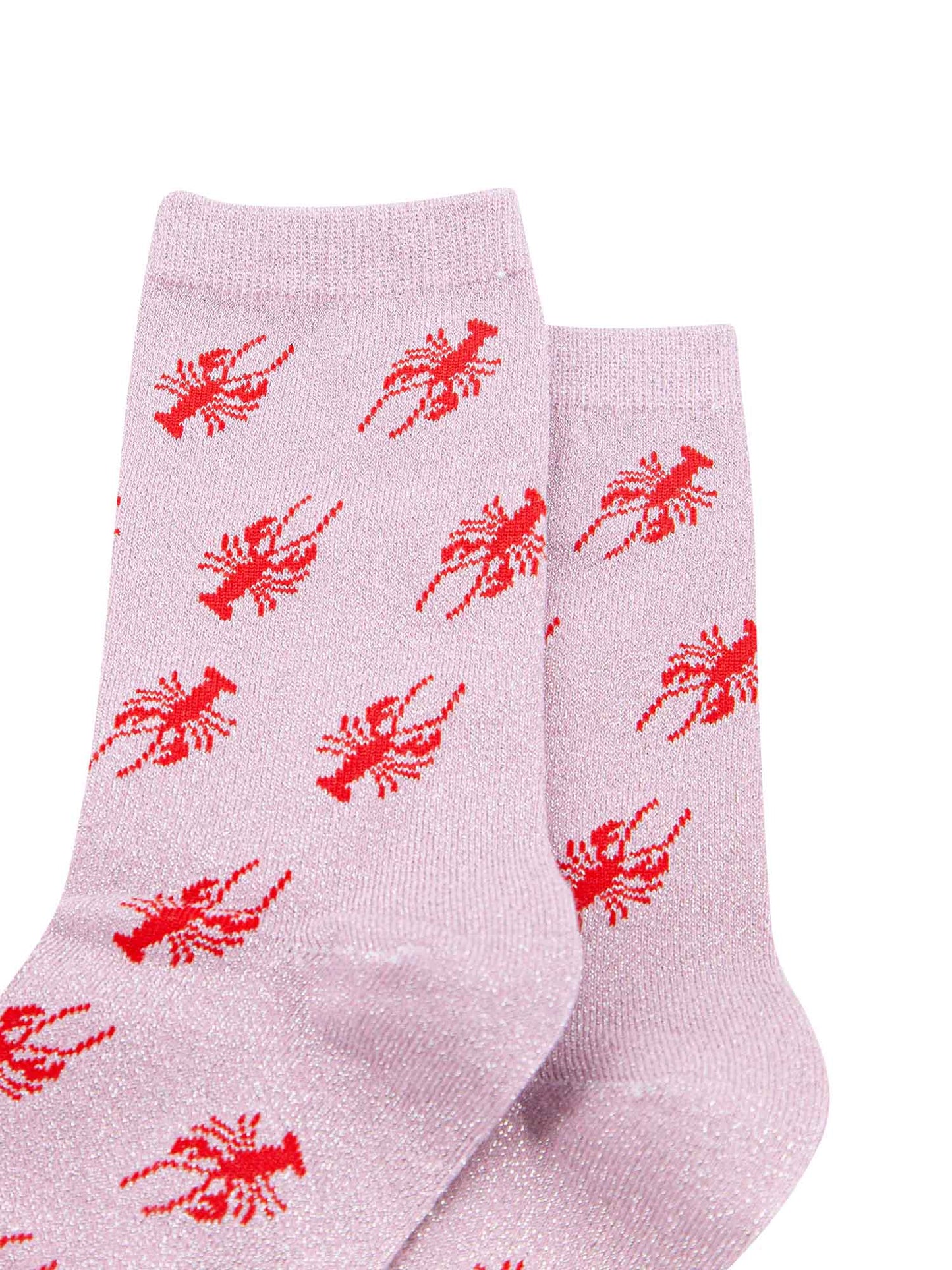 pink cotton socks with an all over red lobster print pattern and silver glitter shimmer, the socks have a scalloped cuff edge