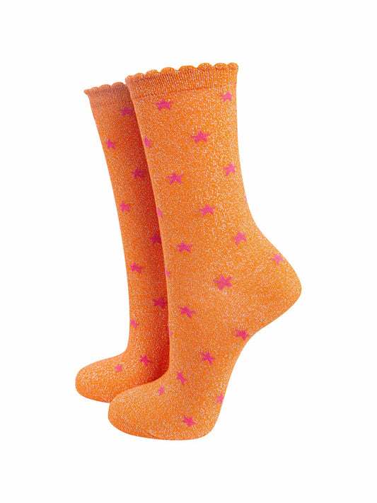 orange glitter ankle socks with an all over pink star pattern and scalloped cuffs