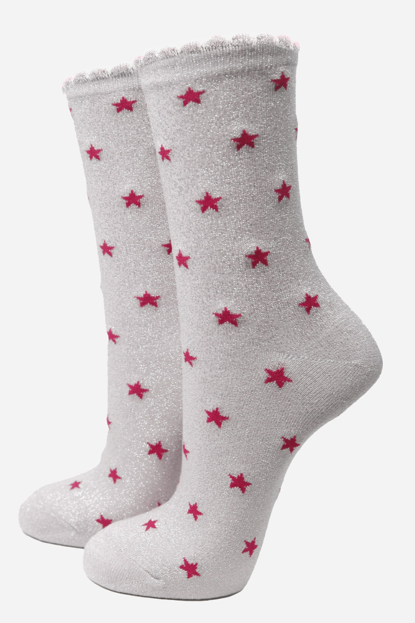 light grey cotton ankle socks with an all over pink star print pattern and silver glitter shimmer, the socks have scalloped cuffs