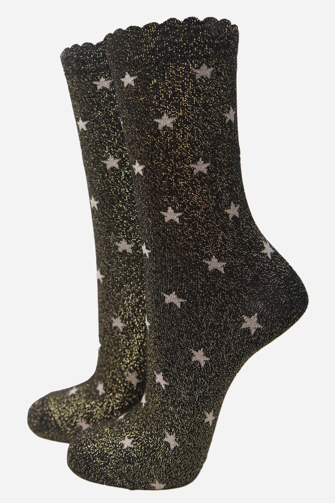 black cotton ankle socks with an all over gold star print pattern and glitter shimmer, the socks have scalloped cuffs