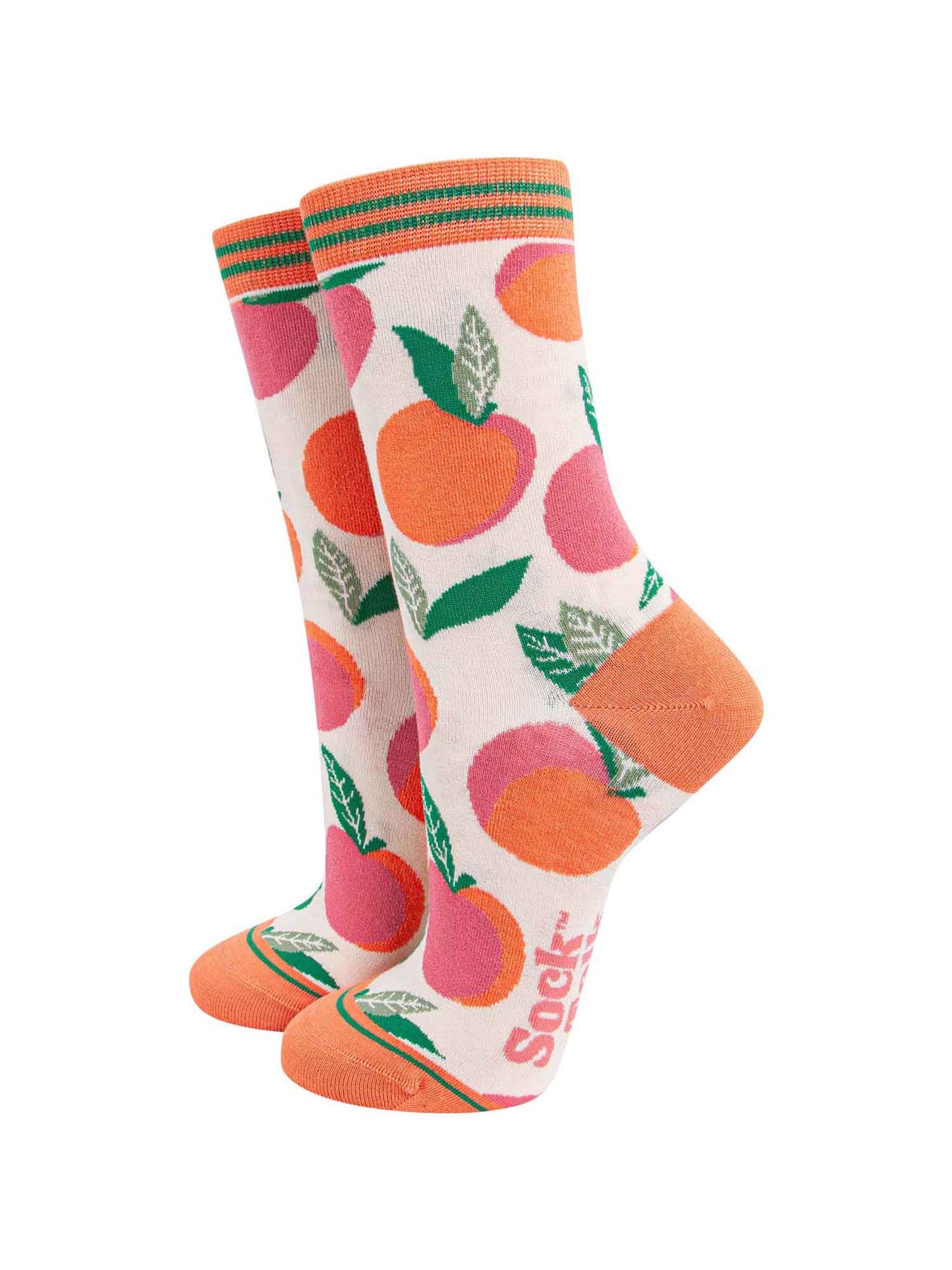 cream and coral bamboo ankle socks with a pattern of peach fruit all over