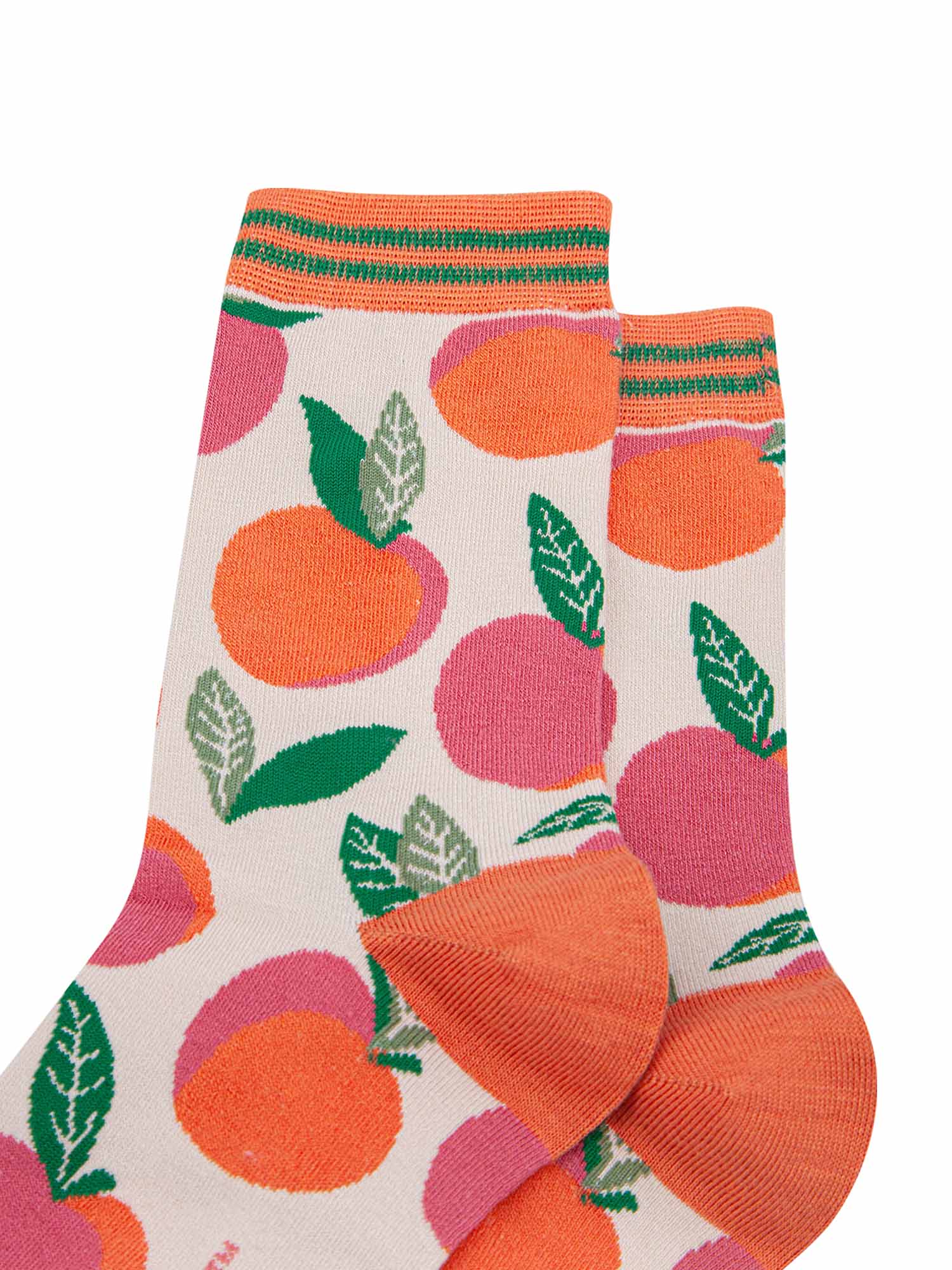 close up of the peaches pattern and striped cuff on the bamboo socks