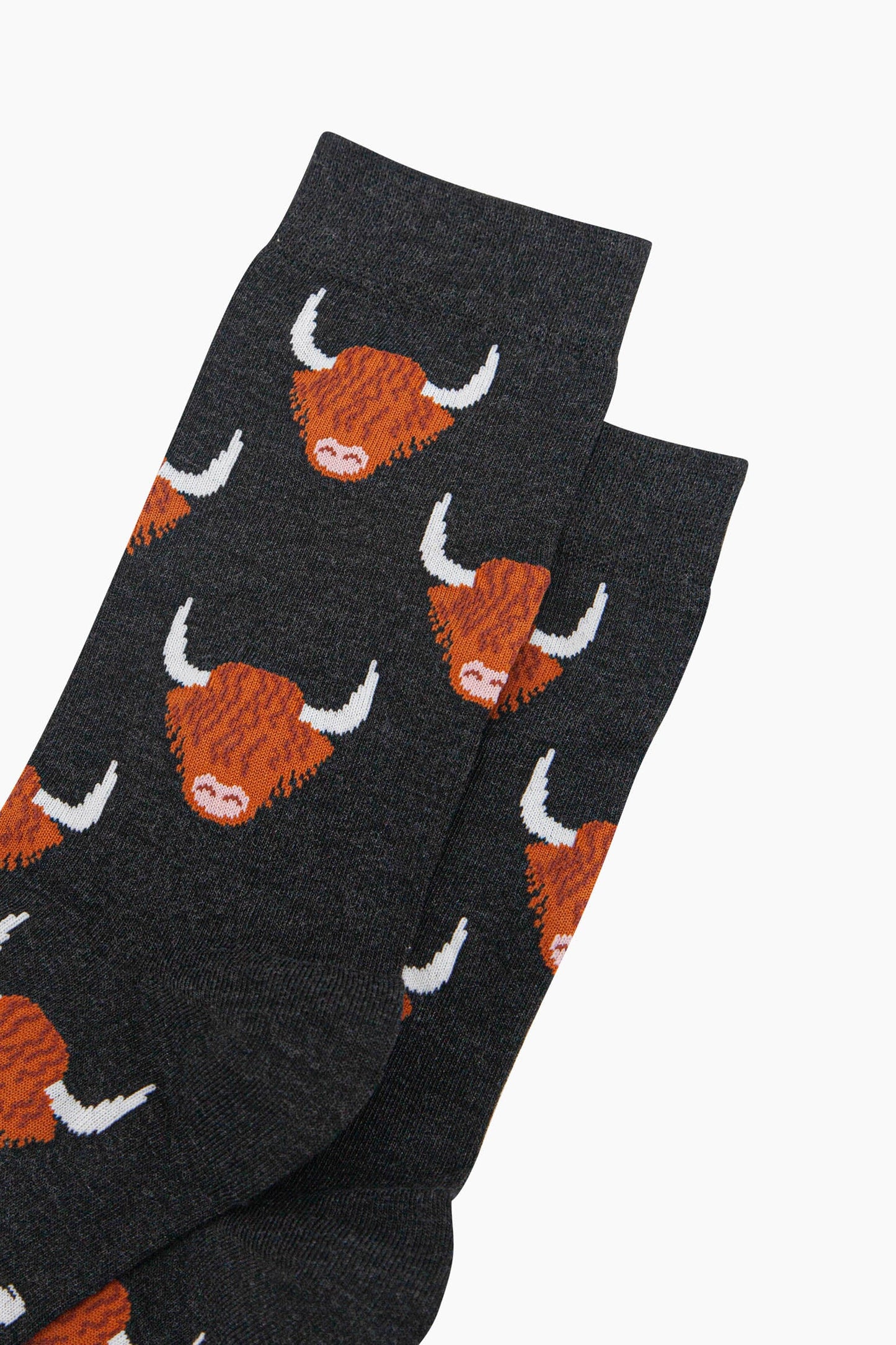 mens-bamboo-socks-black-highland-cow-close-up-orange-brown-scottish-coos