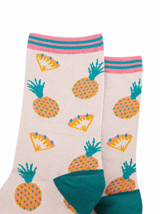 close up of the pineapple and pineapple slice pattern on the ankle socks