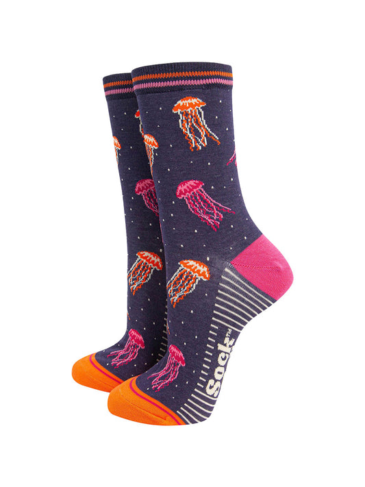 womens-bamboo-socks-navy-jellyfish-showing-the-pattern-of-pink-and-orange-floating-jellyfish-covering-the-design