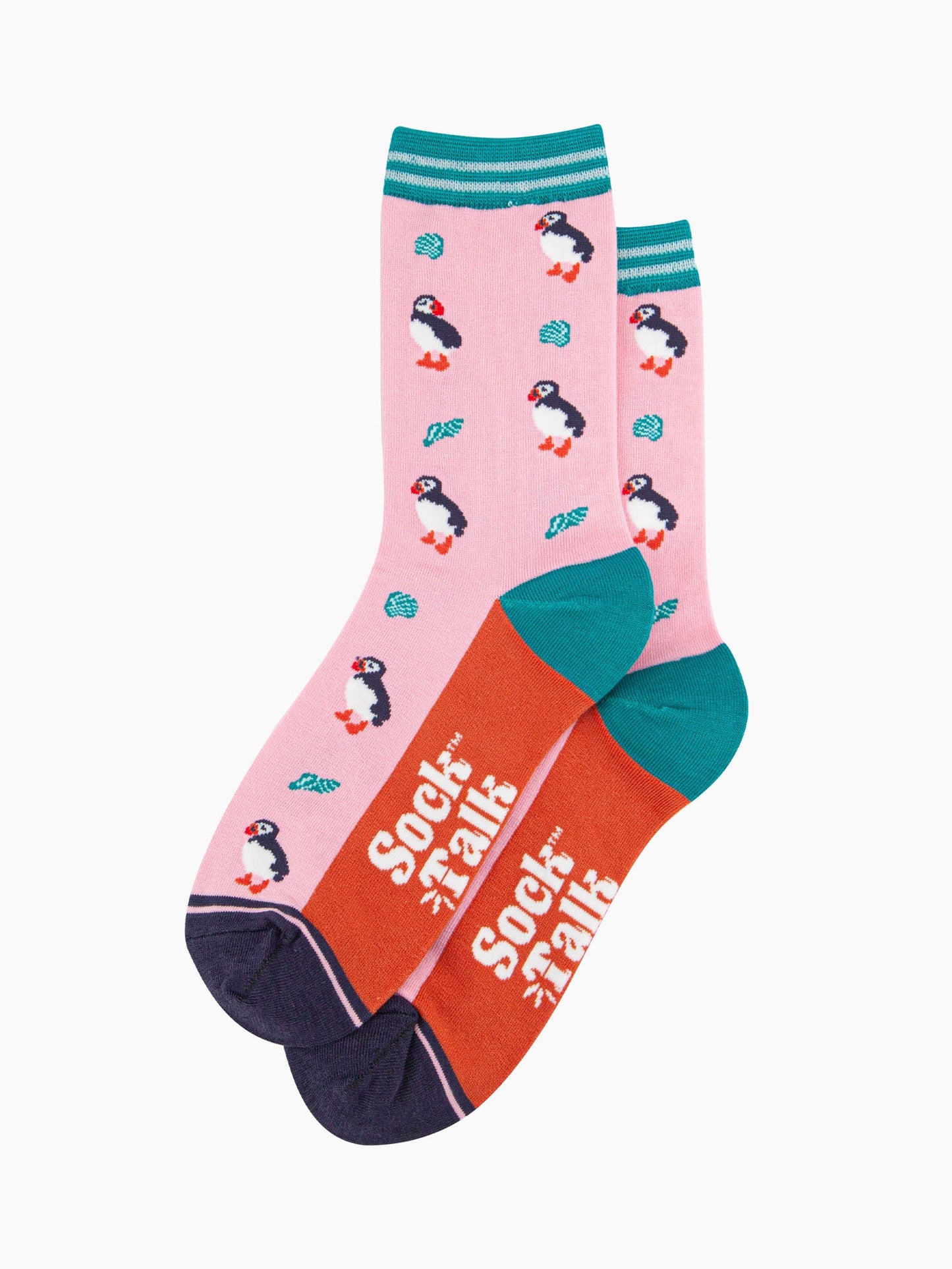 the pair of puffin and seashell socks laying flat, one on top of the other. showing clearly the all over pattern of puffin birds and seashells. the sock talk logo is visible on the base of the sole. 