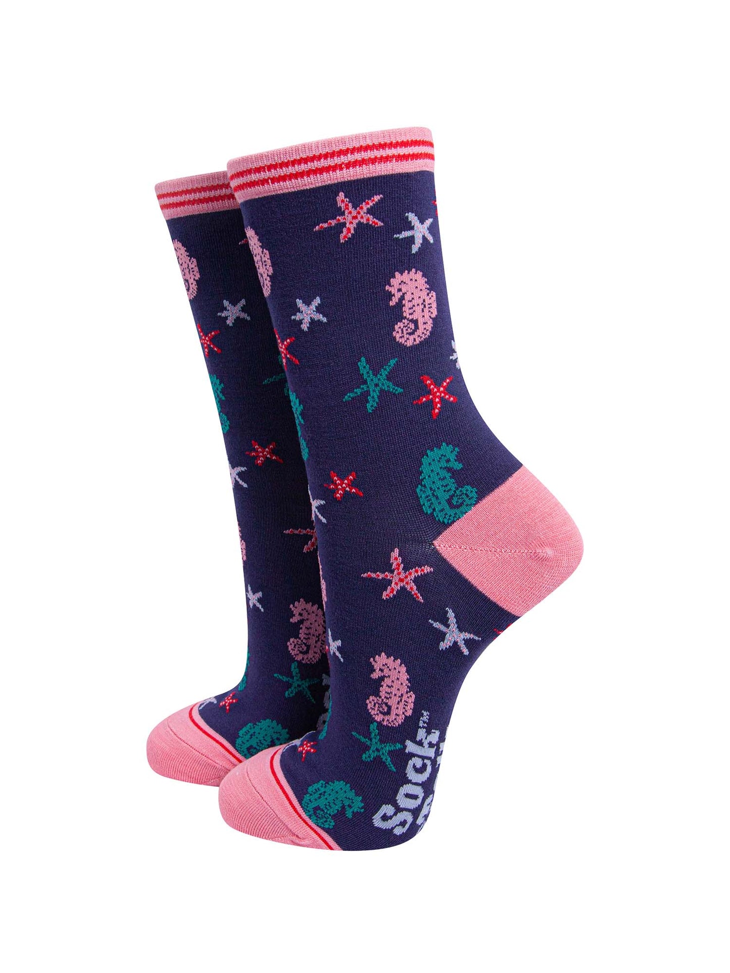 navy blue and pink ankle socks with an all over pattern of star fish and seahorses