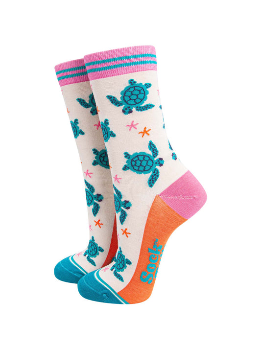 womens-bamboo-socks-cream-sea-turtles-and-starfish-pattern-shows-turquoise-swimming-turtles-and-small-pink-and-orange-starfish
