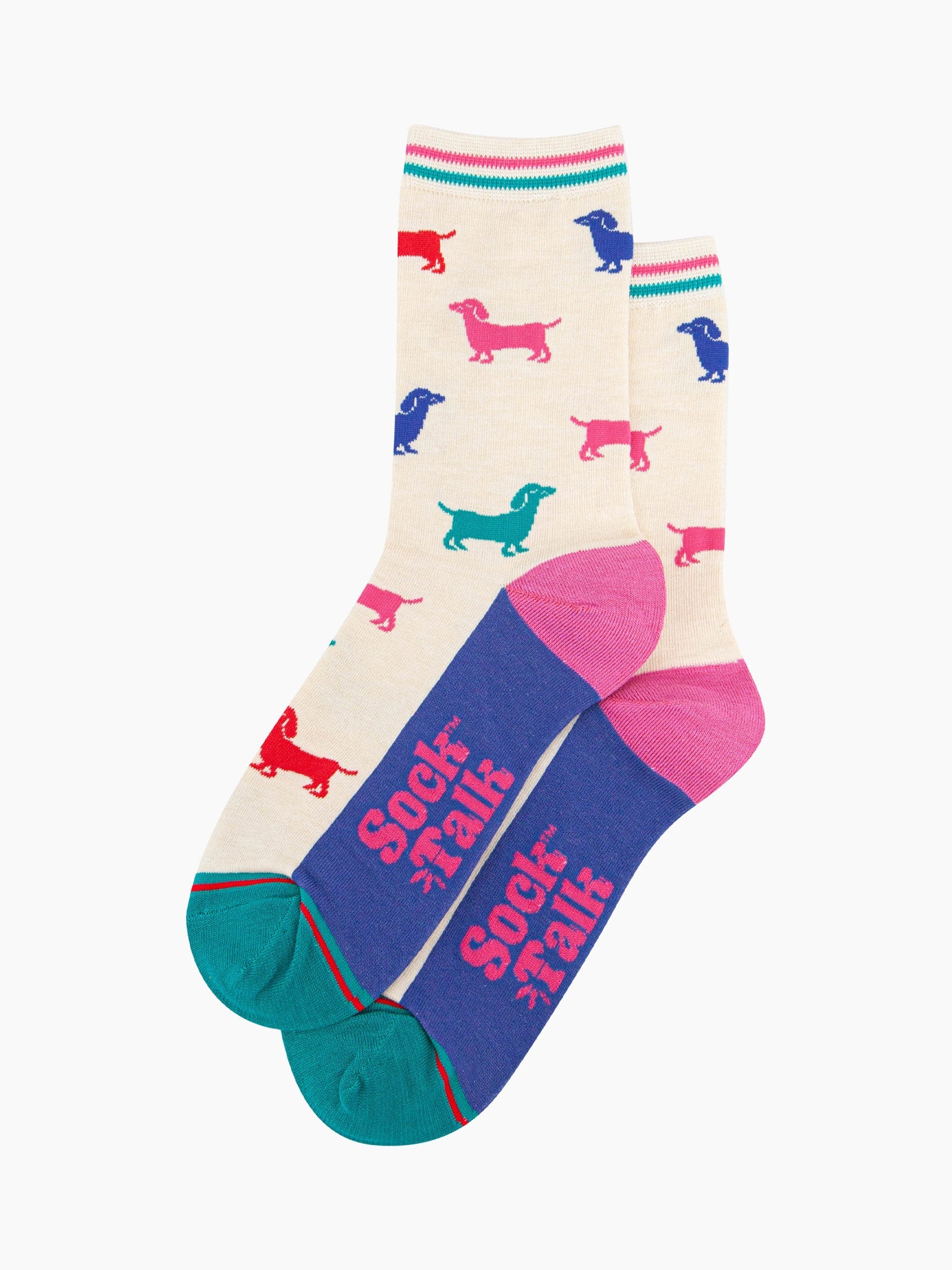the pair of colourful sausage dog socks laying flat, one overlapping the other. showing clearly the cream background of the socks which is contrasted by colourful sausage dog silhouettes. the sock talk logo is visible on the base of the sole. 